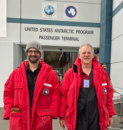 ITS engineers in front of U.S. Antarctic Program Passenger Terminal